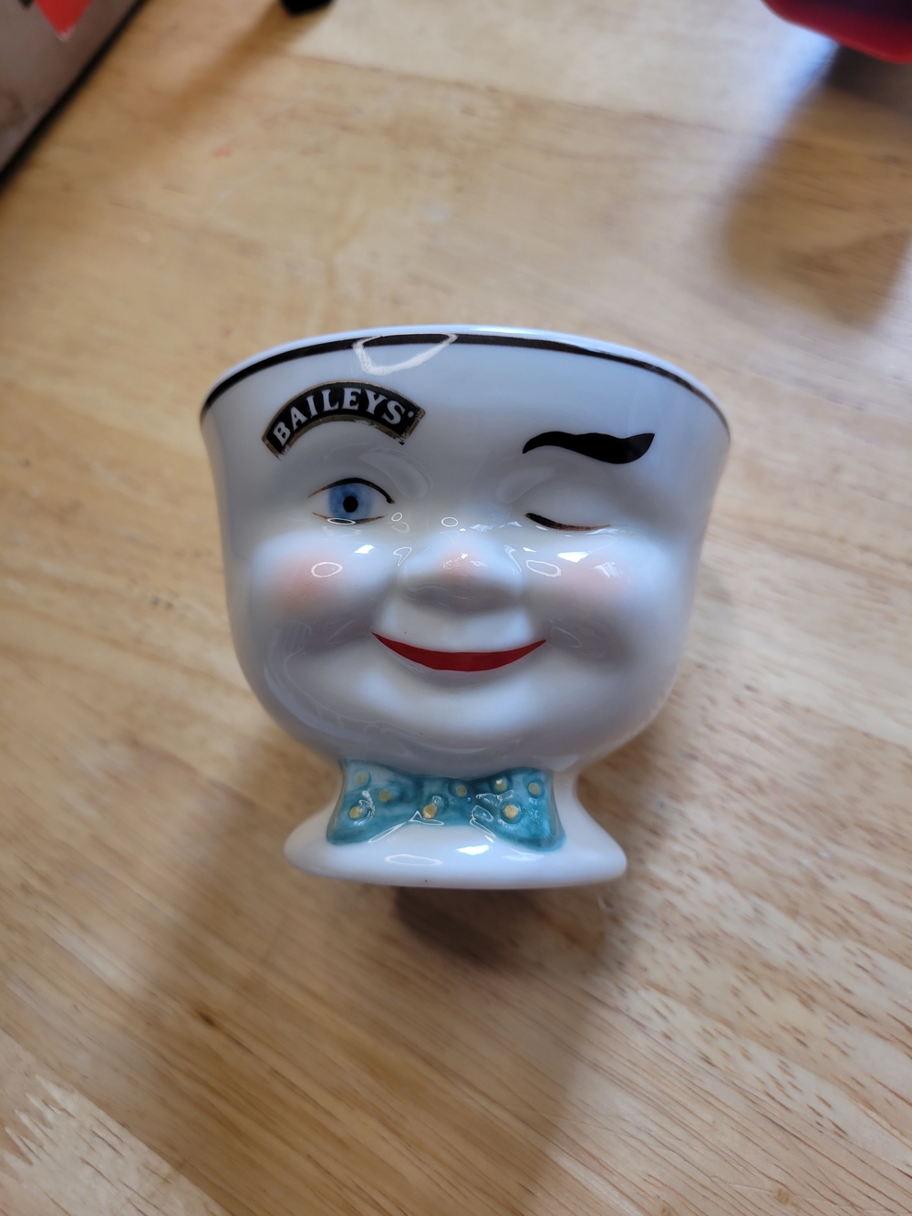 Baileys Winking Face Ceramic Egg Cup - White with Blue Bow